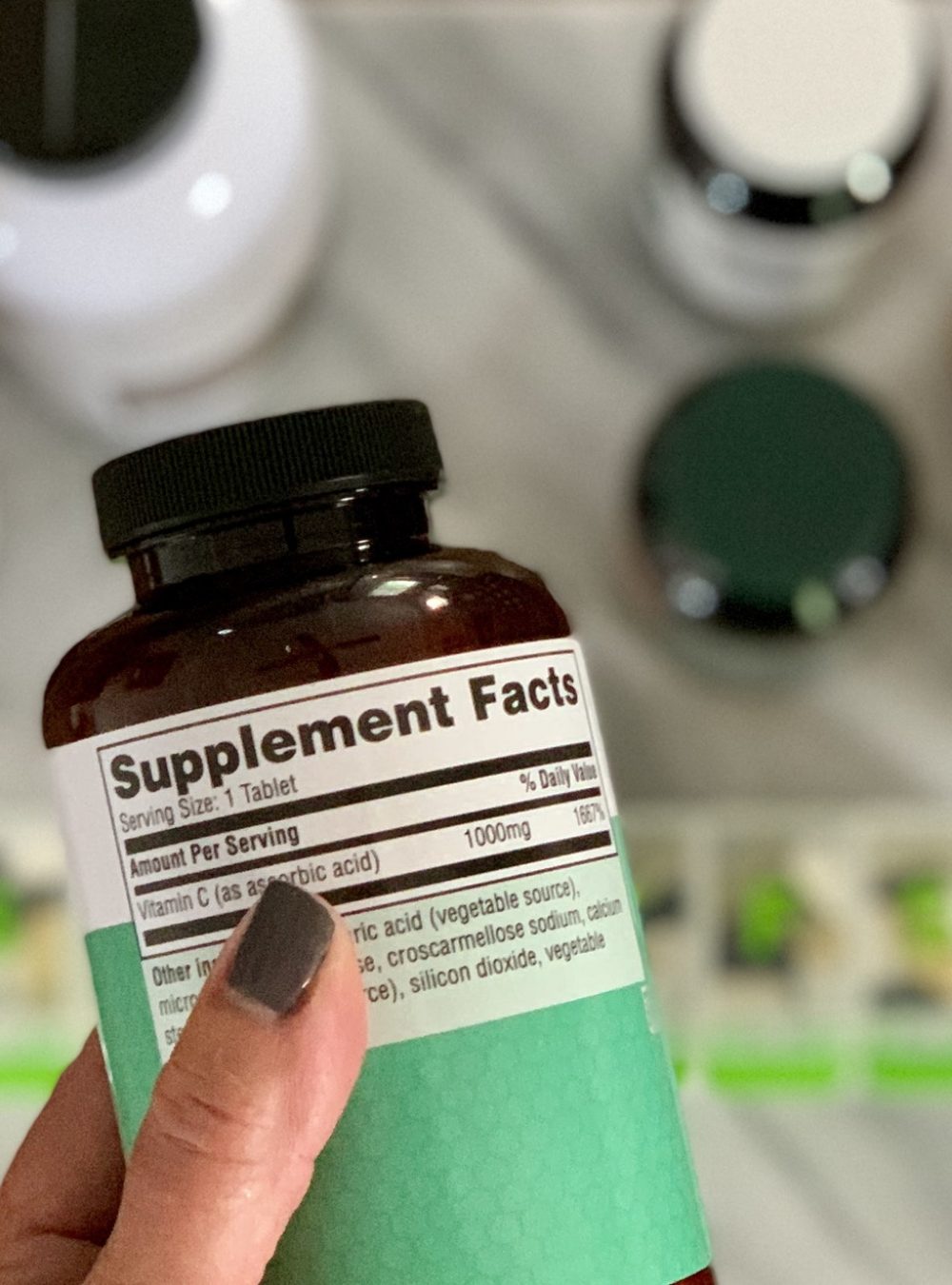 Reading the label on supplement pill bottle